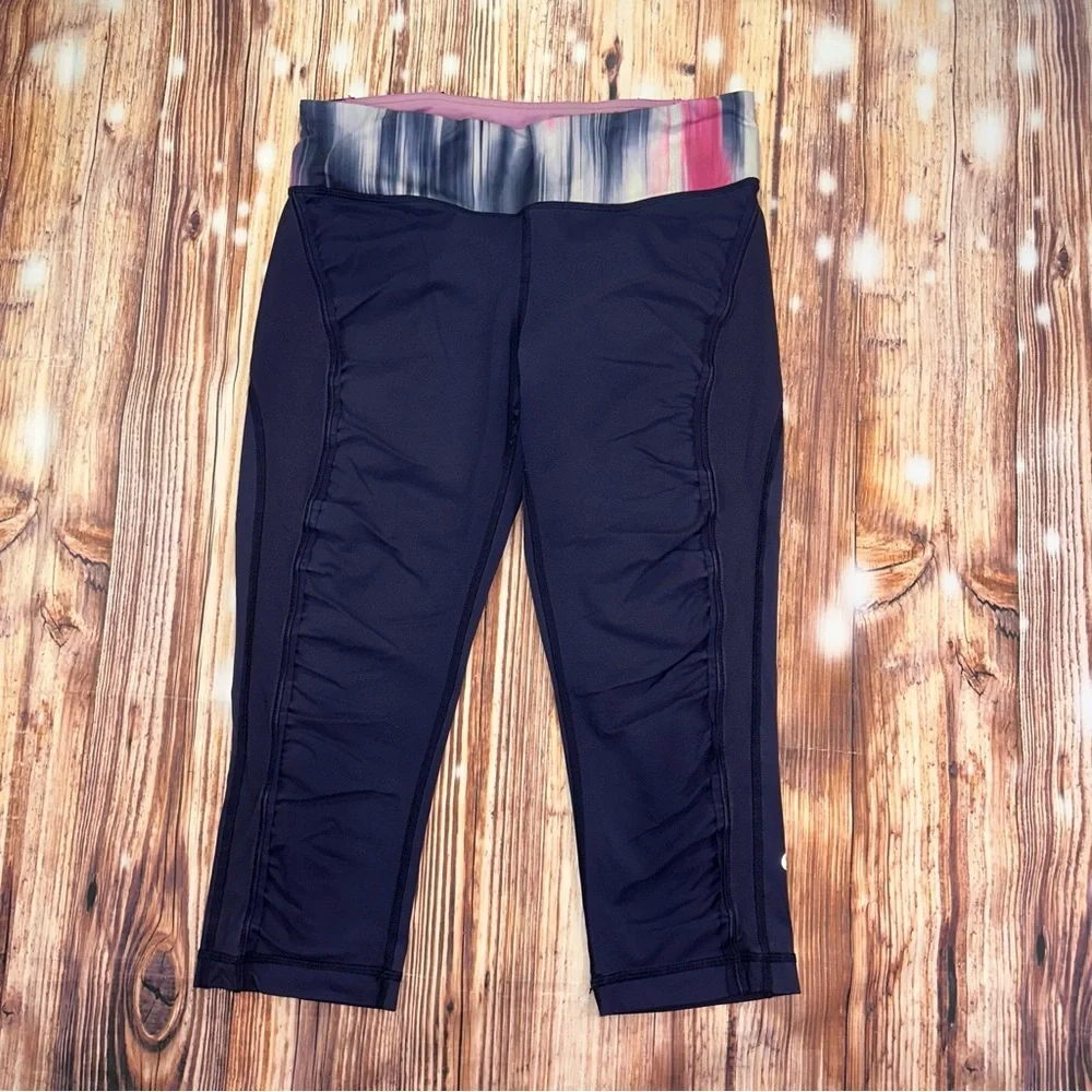Lululemon Dark Navy ,colorful waist ban and slightly cropped leggings Size 8.
